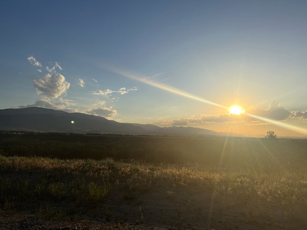 Sunset: golden hour over the valley at East Bench Overlook near Red Lodge, Montana