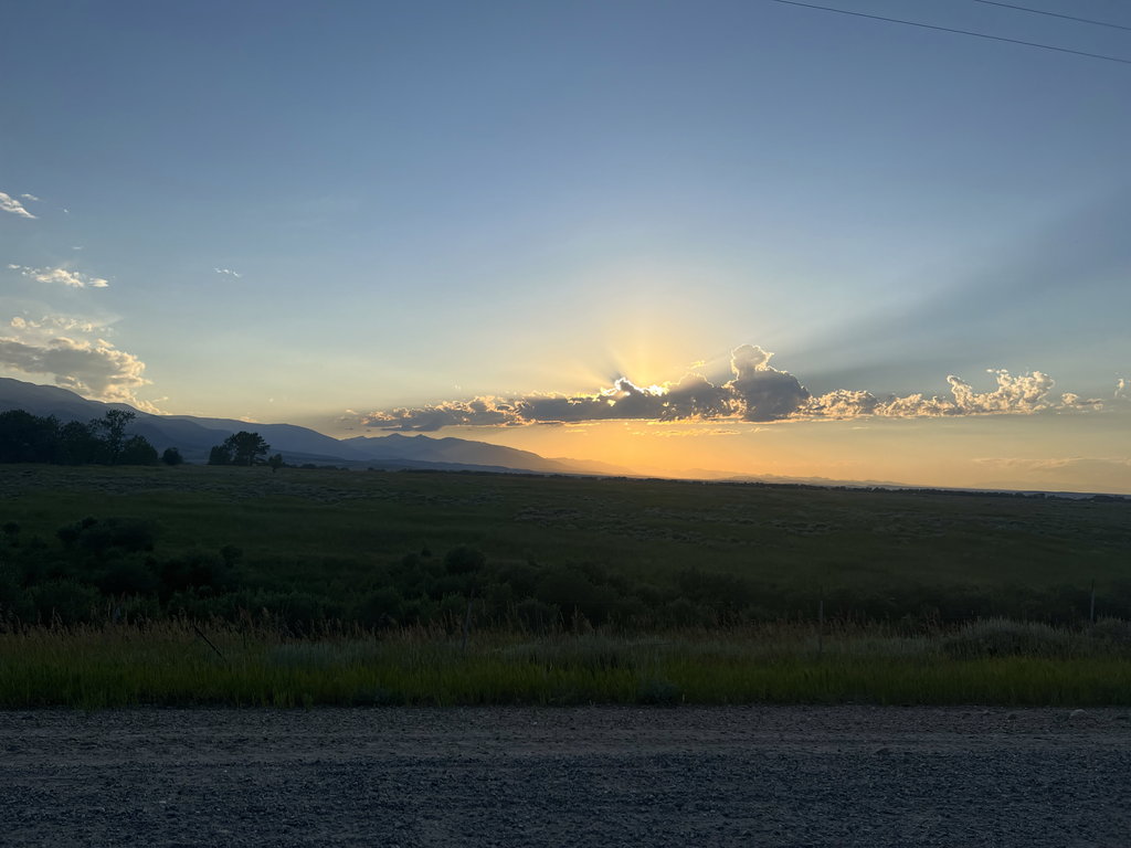 Sunset: light across irrigated fields at East Bench Overlook near Red Lodge, Montana