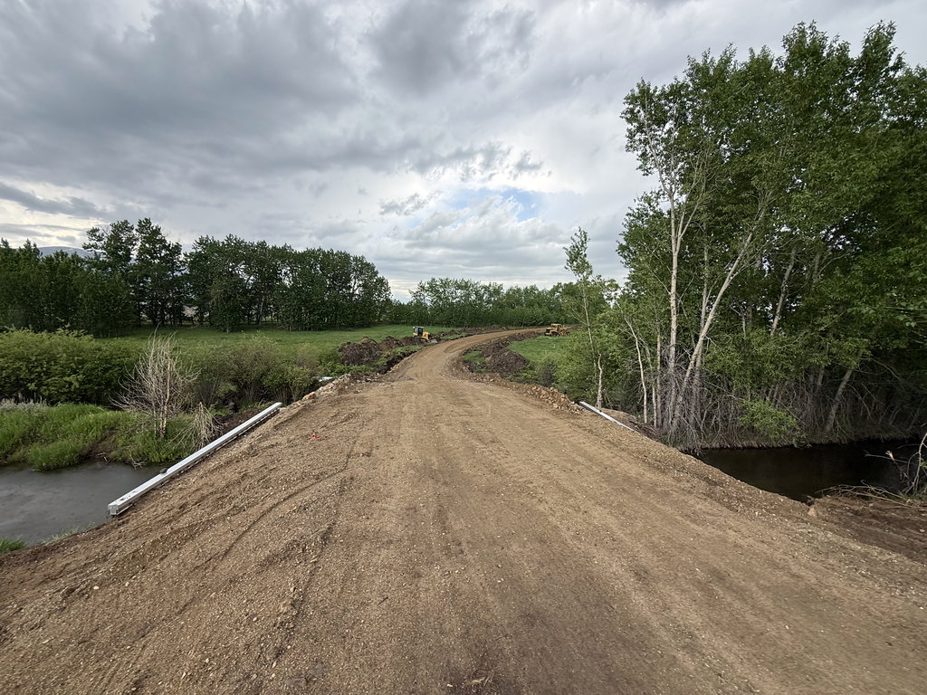 The Road: new gravel through pasture at East Bench Overlook near Red Lodge, Montana