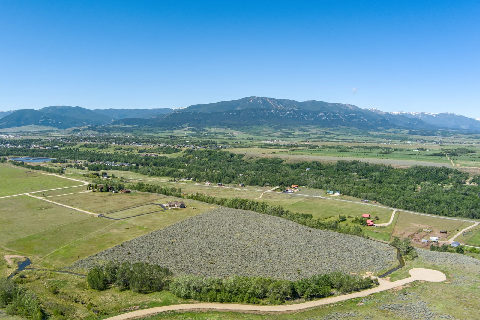 Aerial view of the east bench above Red Lodge, Montana, with the town and Red Lodge Mountain on the horizon