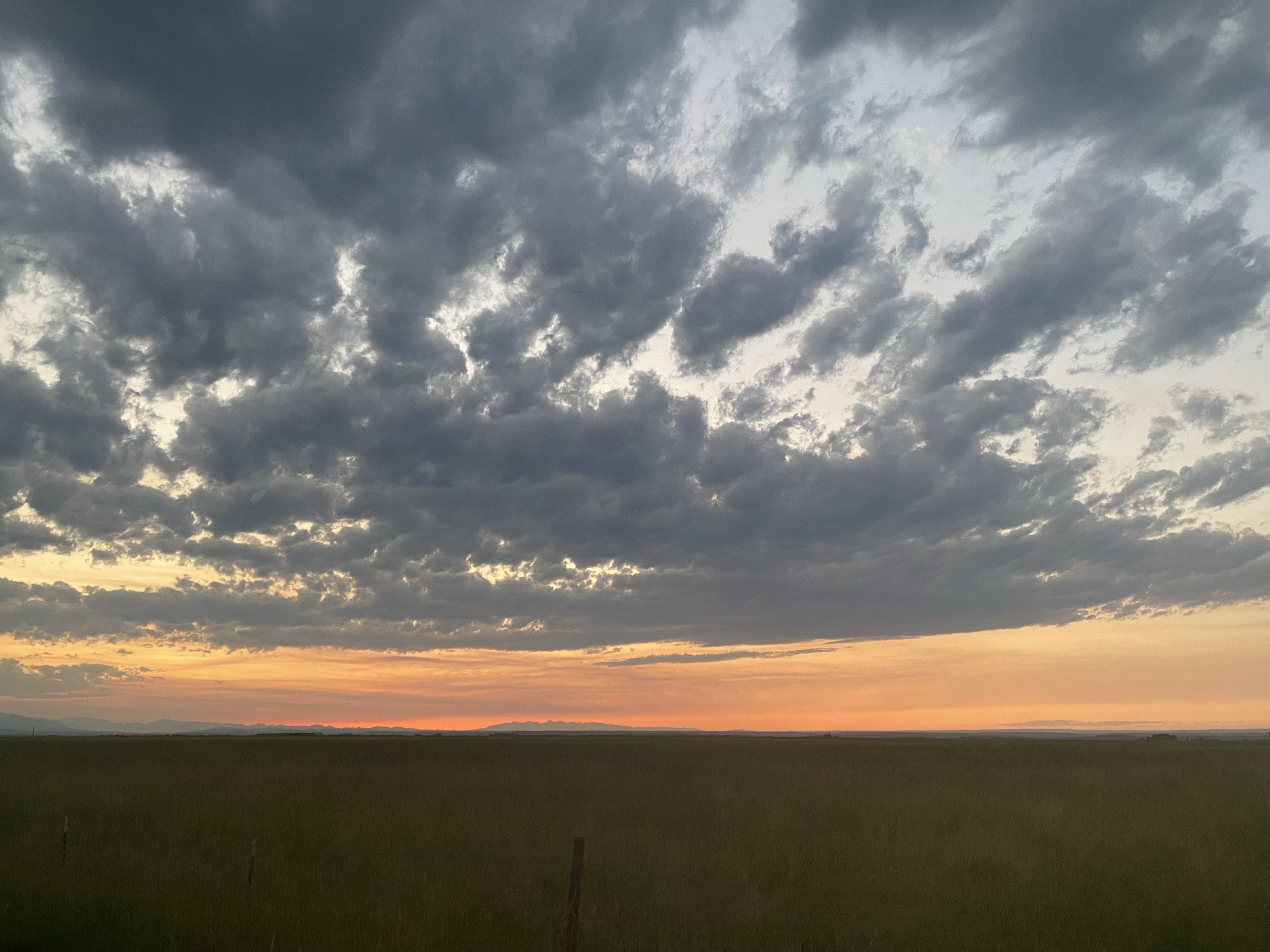 Sunset over grassland homesites at East Bench Overlook