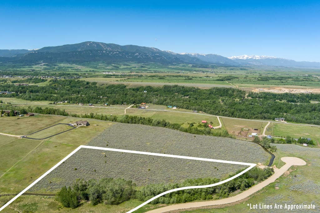 Wide aerial panorama beyond Lot 2 with the snow-capped Absaroka Range on the horizon