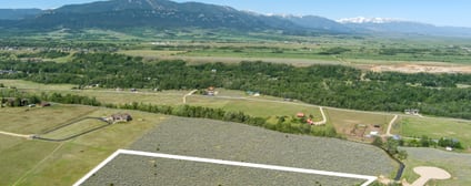 Wide aerial panorama beyond Lot 2 with the snow-capped Absaroka Range on the horizon