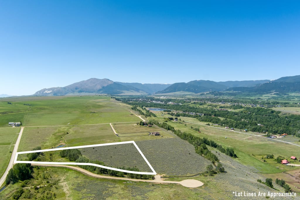 A wide aerial looking down the East Bench across Lot 2 and the surrounding ranchland