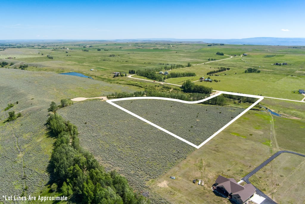 Elevated aerial over Lot 2 with approximate boundary outline and the bench running beyond
