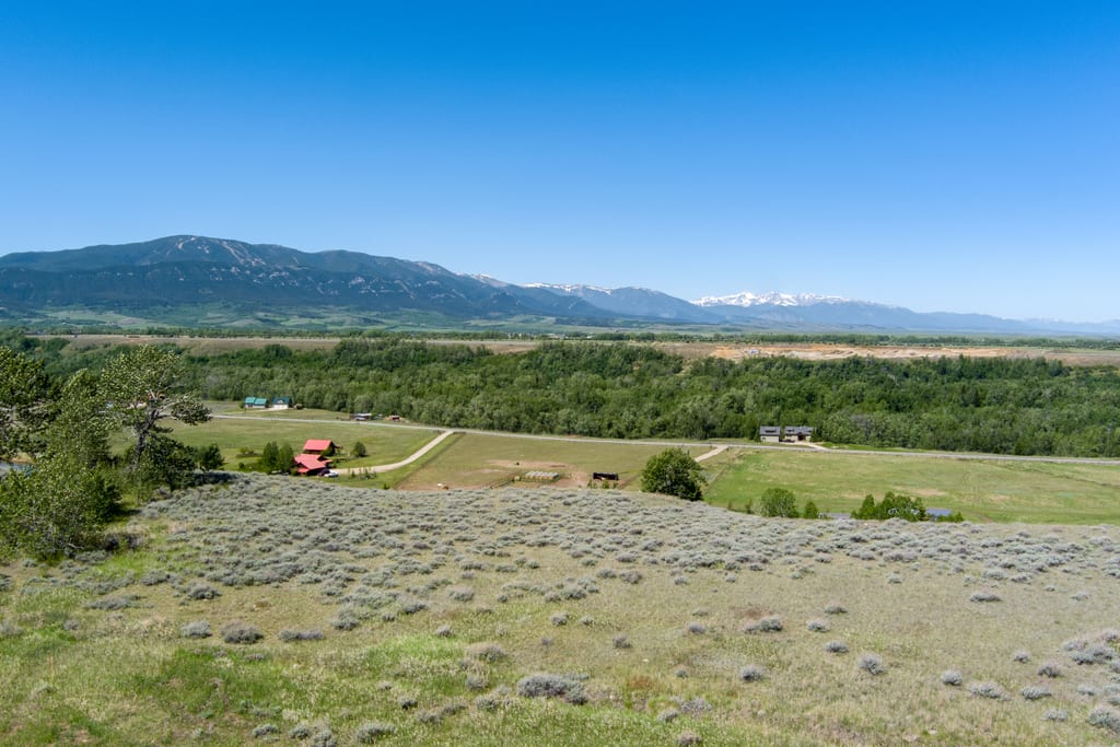 View across the valley from Lot 4 to snow-capped peaks
