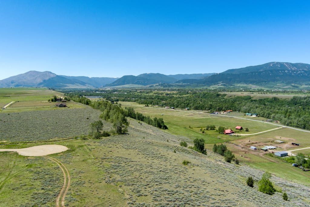 The valley and mountain range beyond the bench at Lot 4