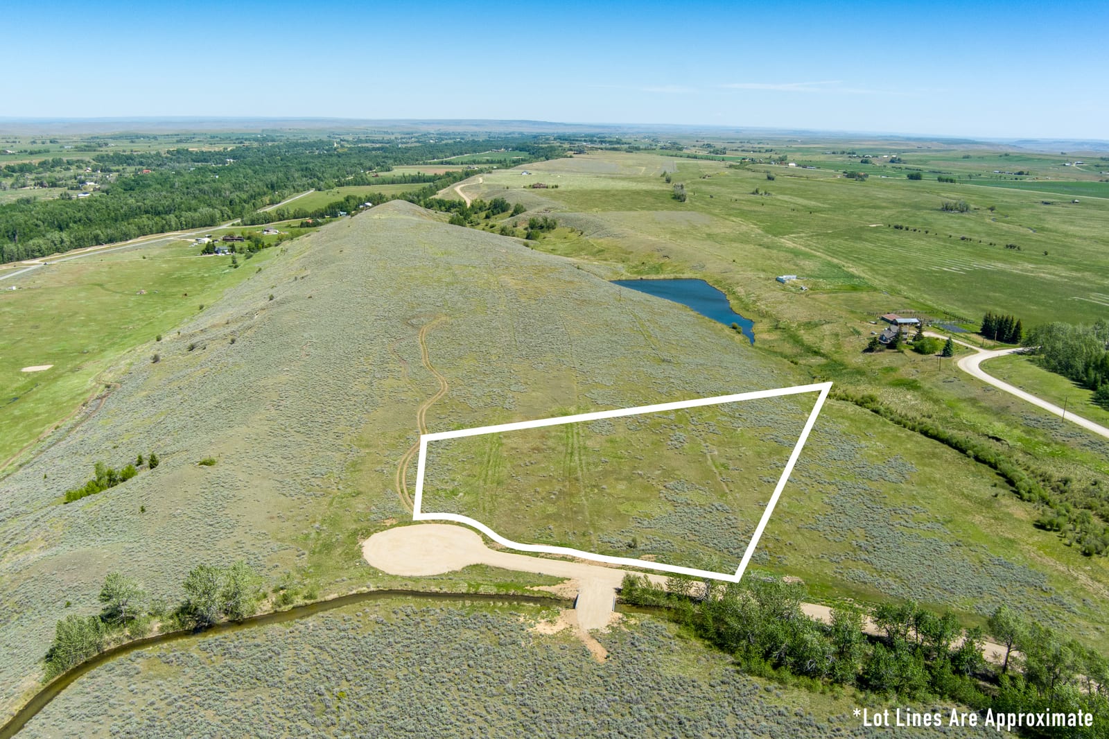 Aerial view of Lot 5 at East Bench Overlook, 5.82 acres near Red Lodge, Montana, with approximate boundary outline