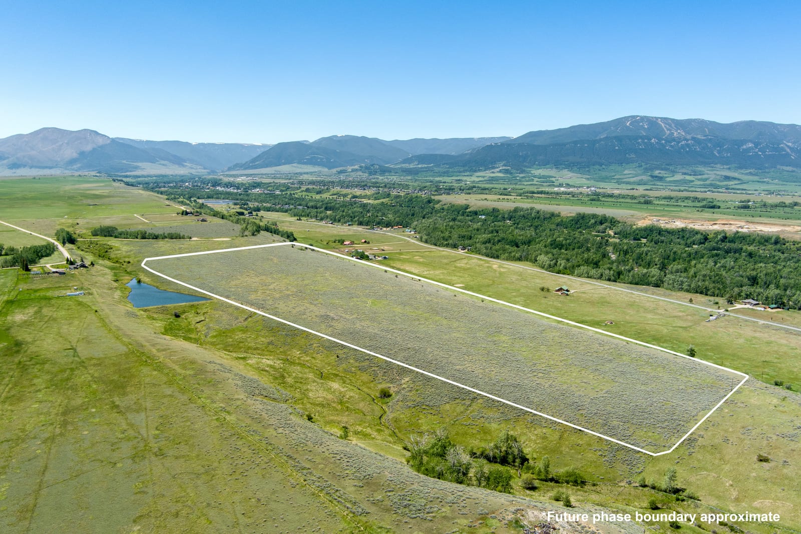 The east bench sweeping toward Red Lodge and the Beartooth Front, with the approximate boundary of the future Graham Subdivision North phase outlined